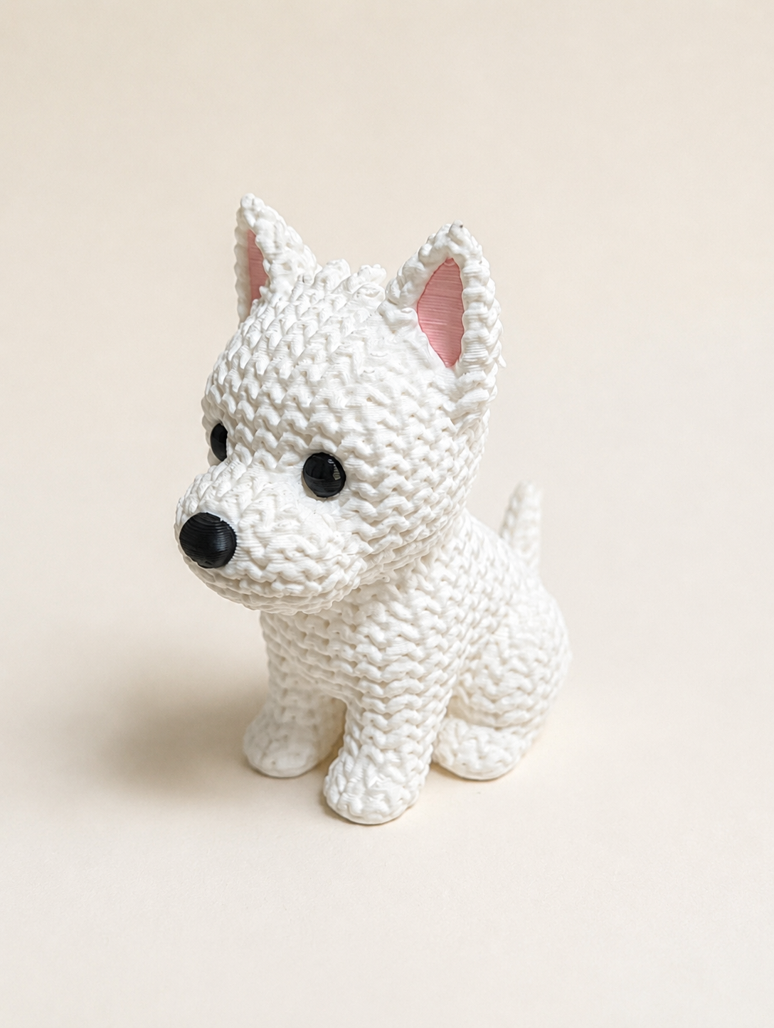 Knitted-style 3D printed white Westie dog figurine, three-quarter view