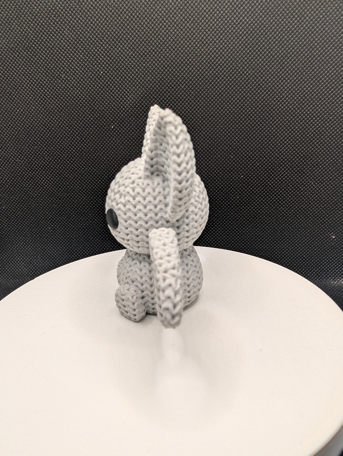 Knitted-style 3D-printed bat figurine with oversized ears and outstretched wings
