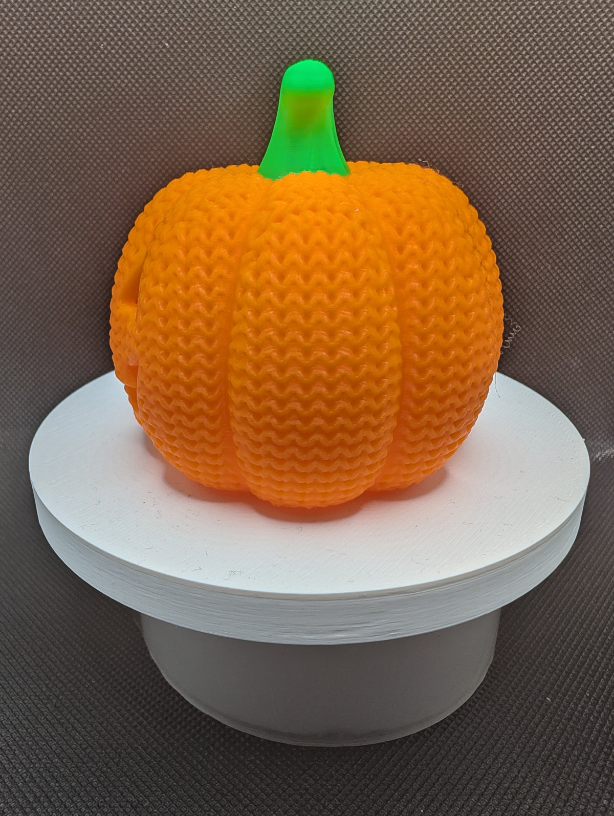 Textured back of orange pumpkin LED tealight holder
