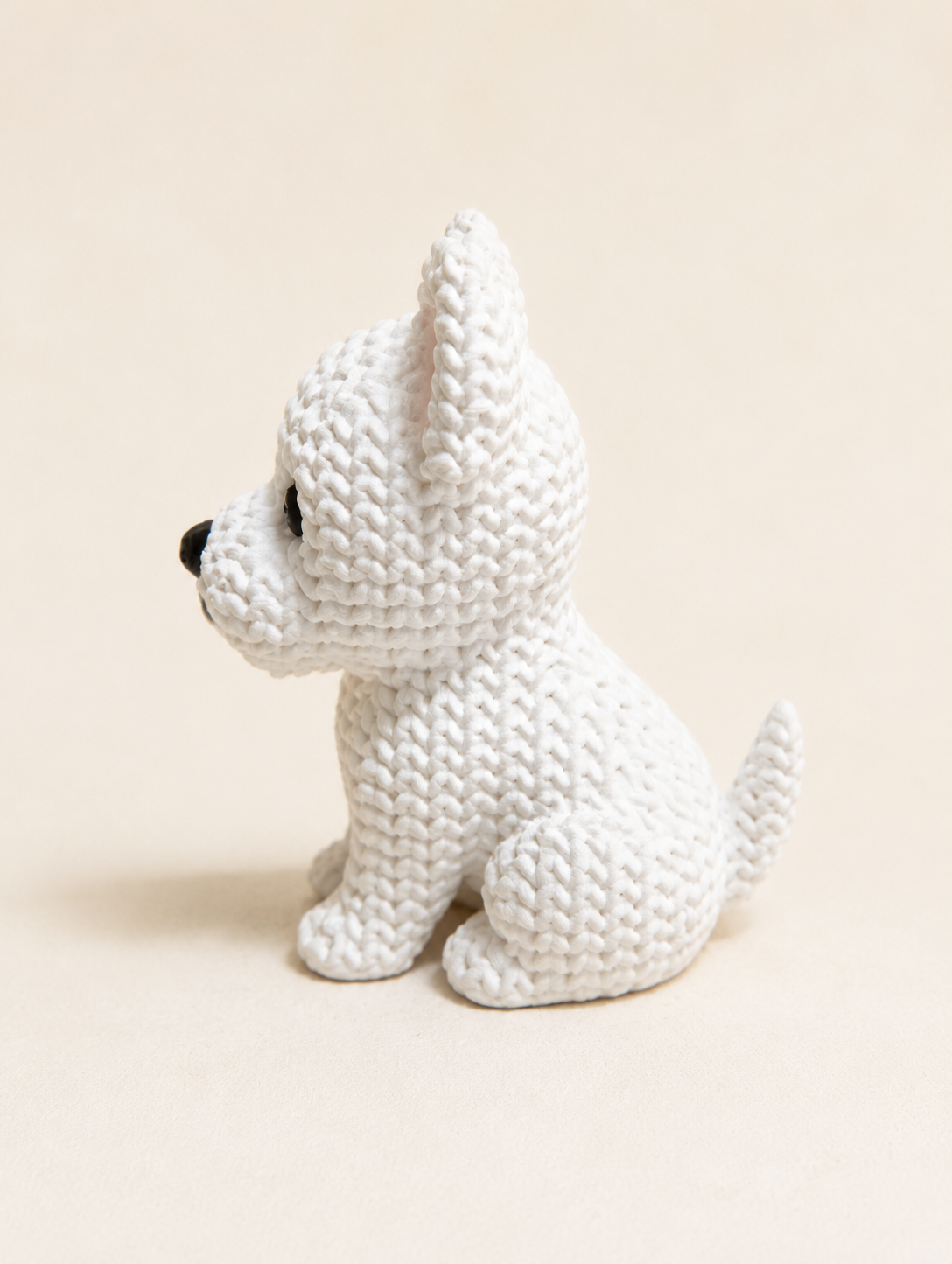 Knitted-style 3D printed white Westie dog figurine, side view