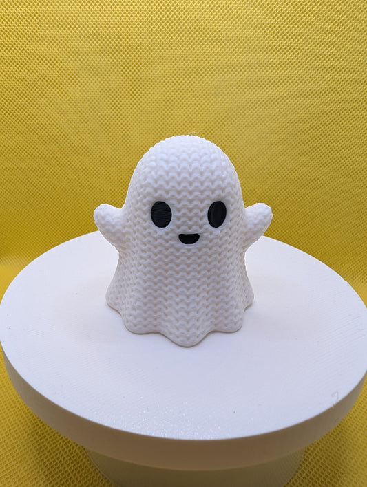 Front view of white smiling ghost with knitted-style texture